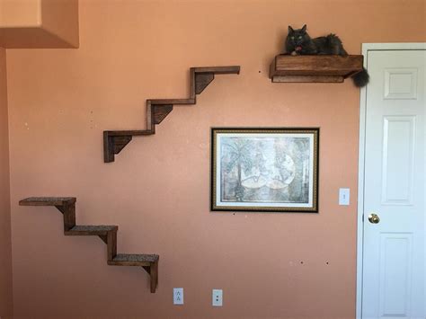 These Floating Cat Stairs Give Your Kitty A View Outside While They Lounge