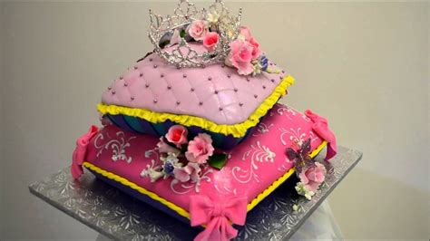 Fluffy, quilted pillow cakes provide the perfect foundation for delicately made tiaras and crowns or gumpaste figures and flowers. Baby princess theme pillow cake - Fondant icing cake ideas ...