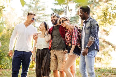 Group Portrait Of Multiethnic Friends Having Fun Together Outdoors