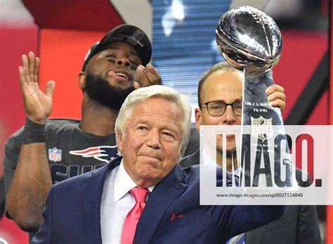 New England Patriots Owner Robert Kraft Holds Aloft The Vince Lombardi