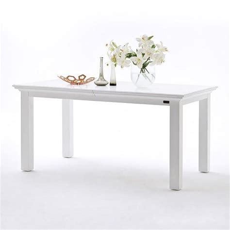 A richly textured oak tabletop is broken up by an open seam exposing metal accents running through the table's center for a stylish industrial mood. Allthorp Solid Wood Extendable Dining Table Rectangular In