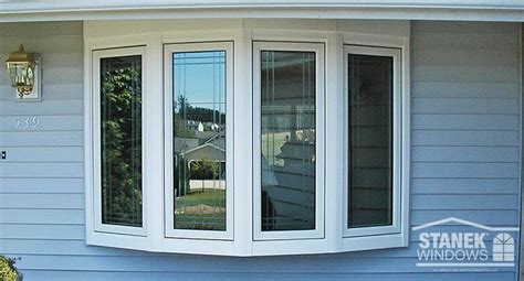 White Four Lite Bow Window With Overhang Tie In And Casement Windows