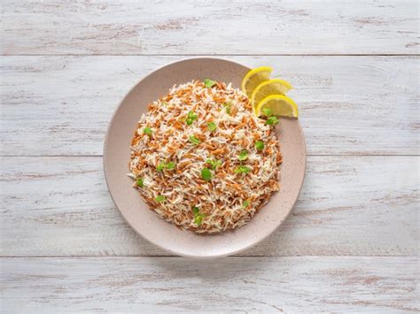 Premium Photo Turkish Rice Pilaf With Orzo In A Plate On A White
