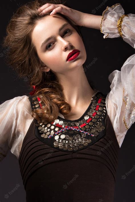 premium photo beautiful russian girl in national dress with a braid hairstyle and red lips