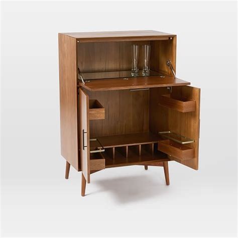 It opens up to reveal plenty of storage for your bottles and stemware. Mid-Century Bar Cabinet - Large | west elm in 2019
