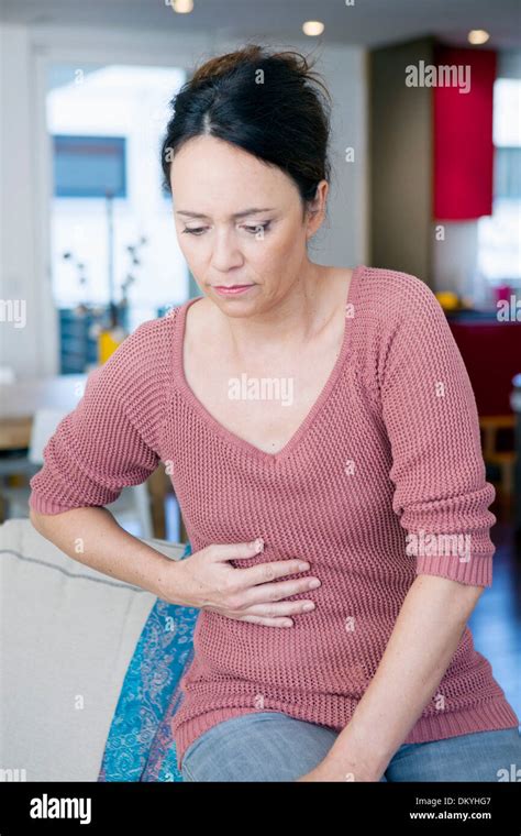 Woman Stomach Pain High Resolution Stock Photography And Images Alamy