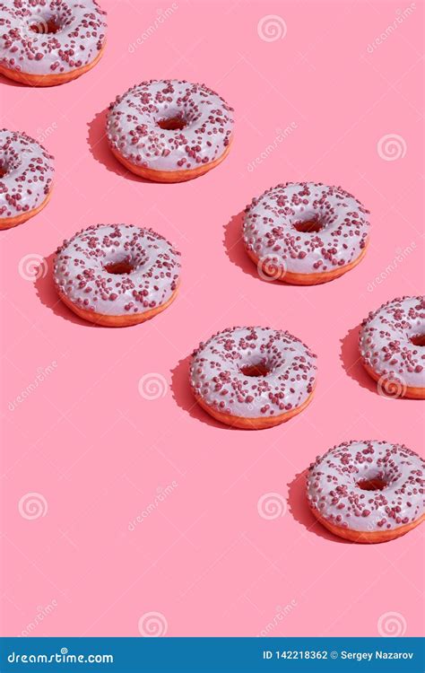 Food Design With Tasty Pink Glazed Donut On Coral Pink Pastel