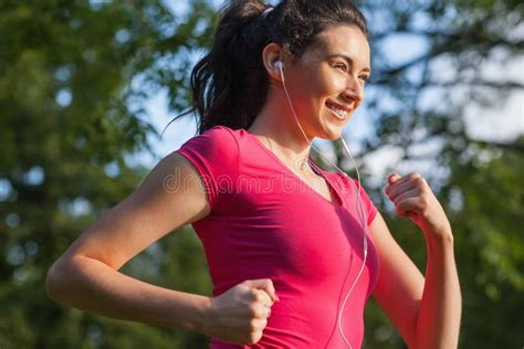 Cheerful Young Woman Jogging In A Park Stock Image Image Of Fitness