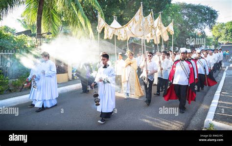 Robed Priests burning incense during Christ the King Procession