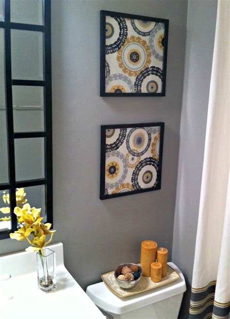 On the white tiled walls are seen two images of a. Yellow decor - becoration