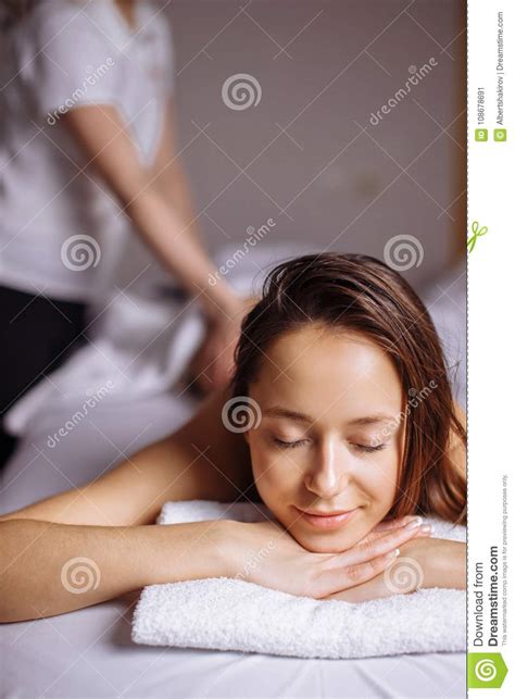 beautiful woman receiving a relaxing back massage at spa stock image image of happy people