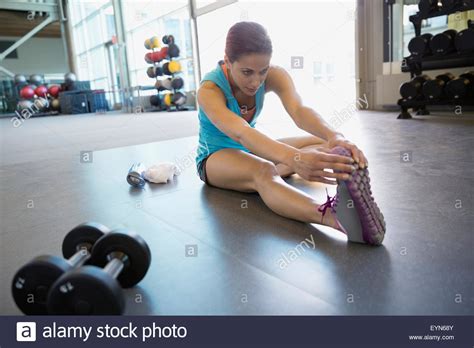 Woman Stretching Leg In Gym Stock Photo Alamy