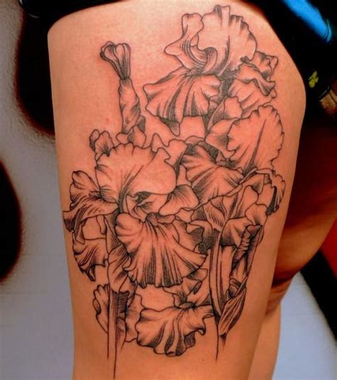 Flower thigh tattoos for females with skull design. Lotus Flower Tattoos Designs on Lower Back