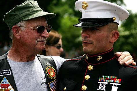 A Marine Vietnam Veteran Embraces Staff Sgt Tim Chambers To Thank Him