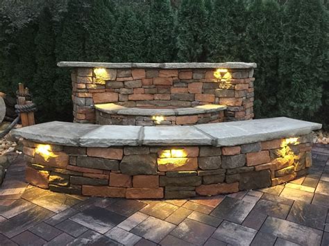 Stone wall light comprises a halo hollowed from white morwad marble with a central 'floating' ball in the form of a brass tipped bulb. 15 Best of Outdoor Stone Wall Lighting