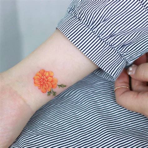 marigold tattoo on the wrist cool wrist tattoos girl arm tattoos