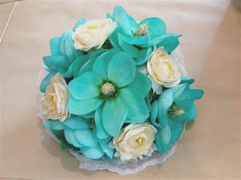 Once called a filler flower, carnations are now a popular choice for weddings. teal flowers