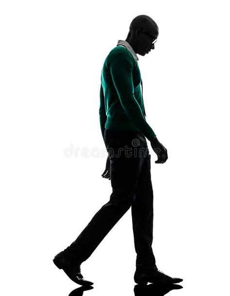 African Black Man Walking Looking Down Sad Silhouette Stock Photo