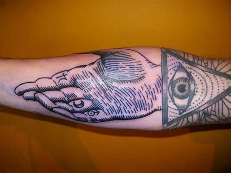 Grey Ink Hand And Triangle Tattoo On Sleeve