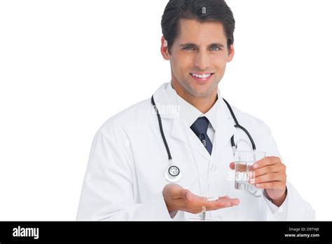 Happy Doctor Smiling And Holding Tablets And Water Stock Photo Alamy