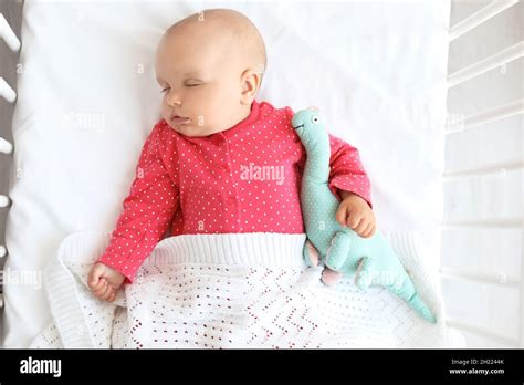 Cute Baby Girl Sleeping In Crib Top View Stock Photo Alamy