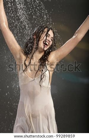 They slowly got eachother wet with the hose until they where fully wet. Happy Young Woman Rain Wet White Stock Photo 99289859 ...