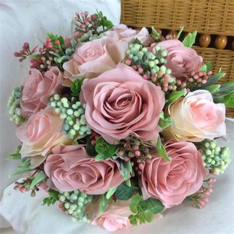 A Wedding Bouquet Of Dusky Pink Artificial Silk Roses And Foliage