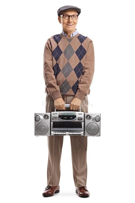 Guy Holding A Boombox On His Shoulder And Sitting On A Wooden Be Stock