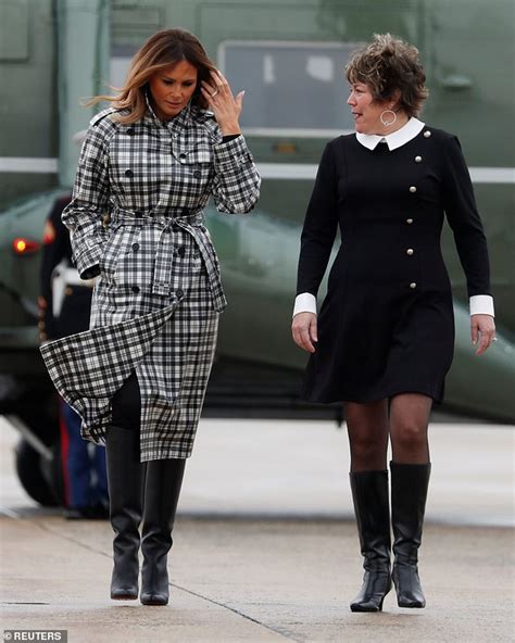 Melania Trump flies to France in a $2,700 raincoat and ...