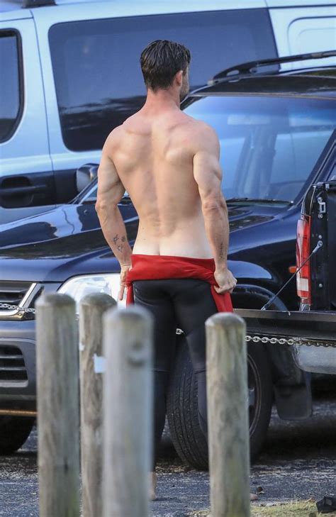 Chris Hemsworth Shows Off Bulging Muscles In Topless Beach Display