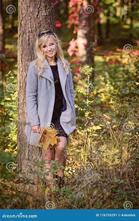 A Young Blonde Woman Walking Through The Forest On A Sunny Autu Stock Image Image Of