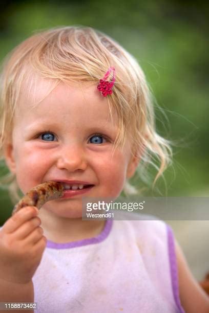 Girl Eating Sausage Photos And Premium High Res Pictures Getty Images