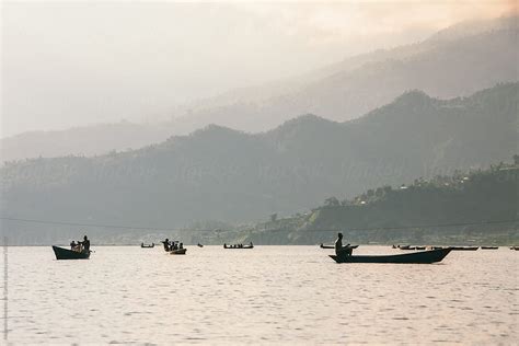 Boats On A Lake At Sunset Travel In Pokhara Nepal By Stocksy Contributor Alejandro Moreno