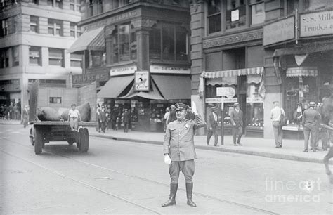 policeman directing city traffic by bettmann