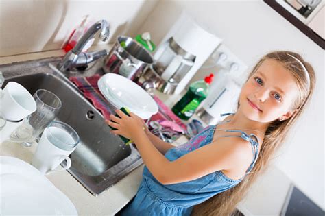 Girl Doing Dishes At Kitchen Stock Photo Download Image Now 2015
