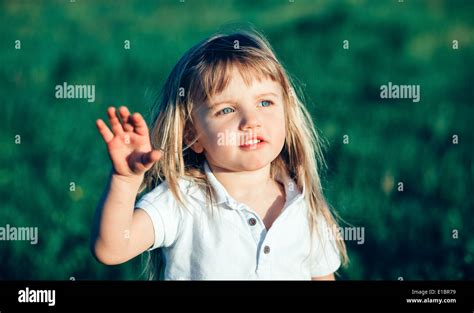 Little Girl Waving Stock Photo Alamy