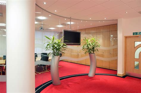 Glass screens for reception desks are custom designed and installed in hospitals to ensure safety a purpose designed reception desk glass security screen. Glass Partitions in Reception Areas | GYC Glass Partitions