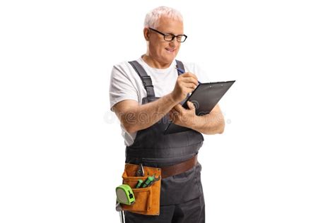 Repairman With A Tool Belt Writing On A Clipboard Stock Image Image