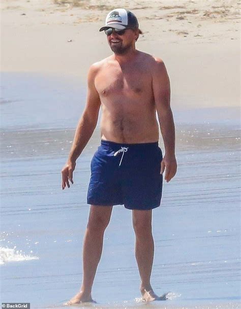 leonardo dicaprio flashes his oscar winning smile at the beach