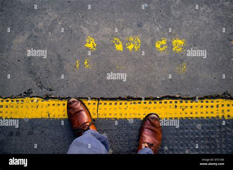 Man Standing On Train Platform Yellow Safety Line Stock Photo Alamy