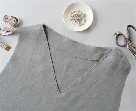 How to sew a v neck with bias tape treasurie. Sewing Glossary: How to Sew a Facing to a V-Neckline ...