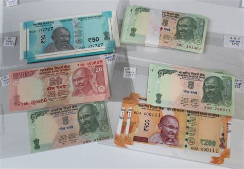 A Collection Of Indian Banknotes Including A Consecutive Run Of One