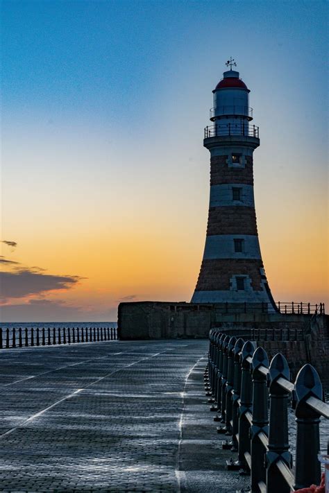 Roker Sunrise Lighthouse At First Light Seascapes Along The