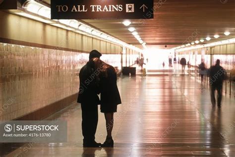 Couple Saying Goodbye In Hallway To Departing Trains At Union Station