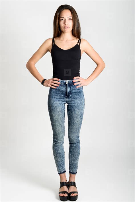 Young Woman Wearing Black Tank Top And Blue Jeans Stock Photo 185553