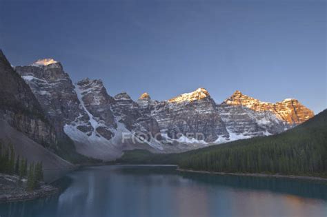Alpenglow On Rocky Mountains With Reflection In Moraine Lake Valley Of