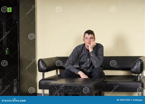 Bored Or Anxious Man Sitting In A Waiting Room Stock Image Image Of Settee Leather 55921959