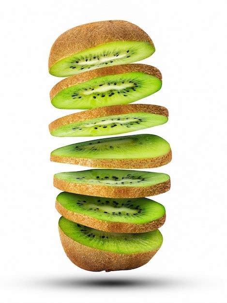 Premium Photo Fresh Sliced Kiwi Fruit Flying In The Air Isolated On