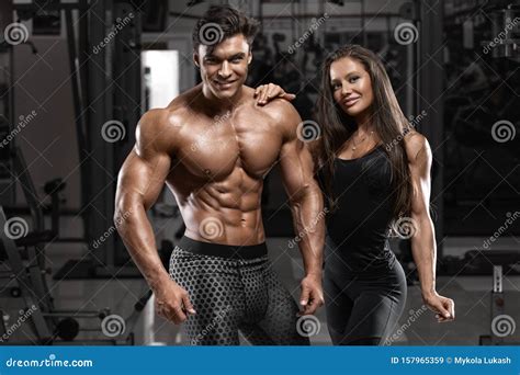Sporty Couple Showing Muscle And Workout In Gym Muscular Man And Wowan Stock Image Image Of