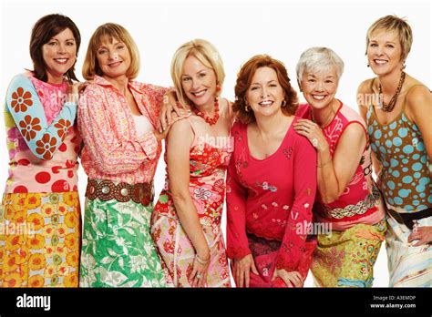 Portrait Of A Group Of Mature Women Standing And Smiling Stock Photo